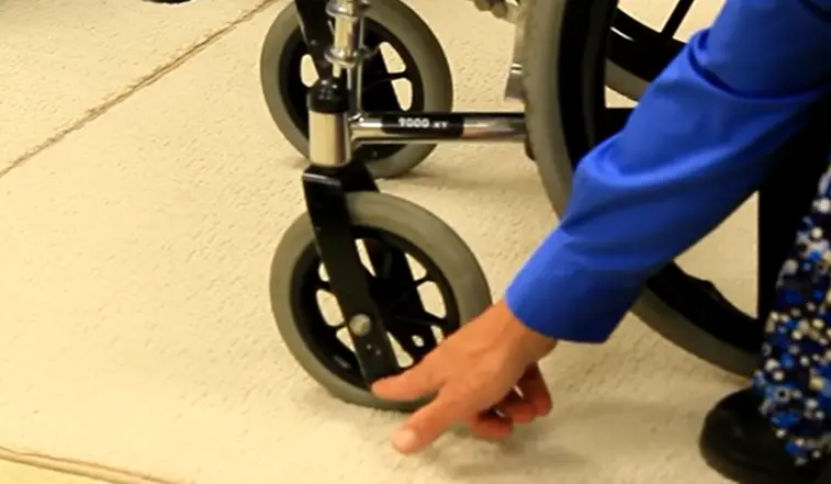 Wheelchair height adjustment with rear wheels